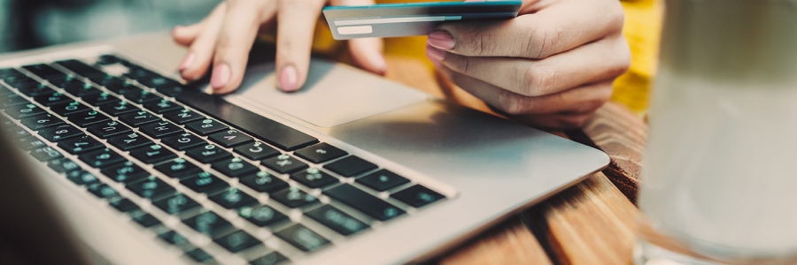 Woman paying online with her credit card