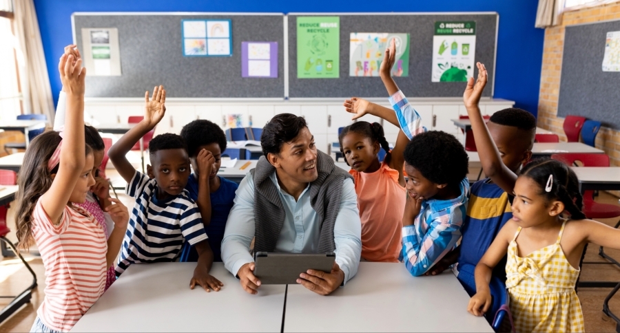 man with students in a classroom