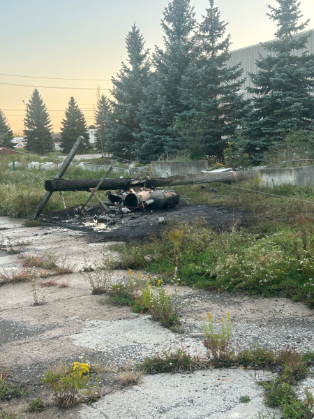 Hydro pole with three transformers that has severe damage from fire.