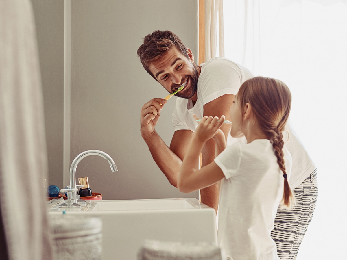 Father and daughter brushing teeth Father and daughter brushing teeth