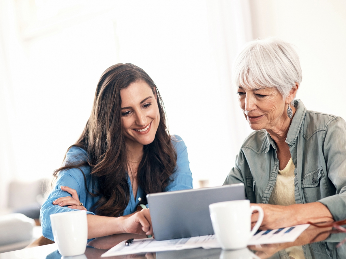 Two women looking at screen