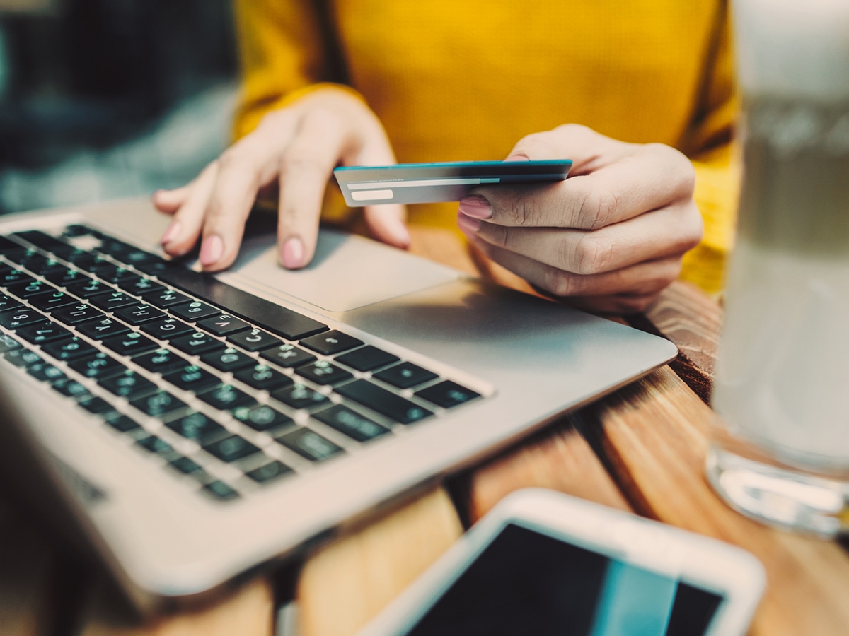 Woman paying online with her credit card