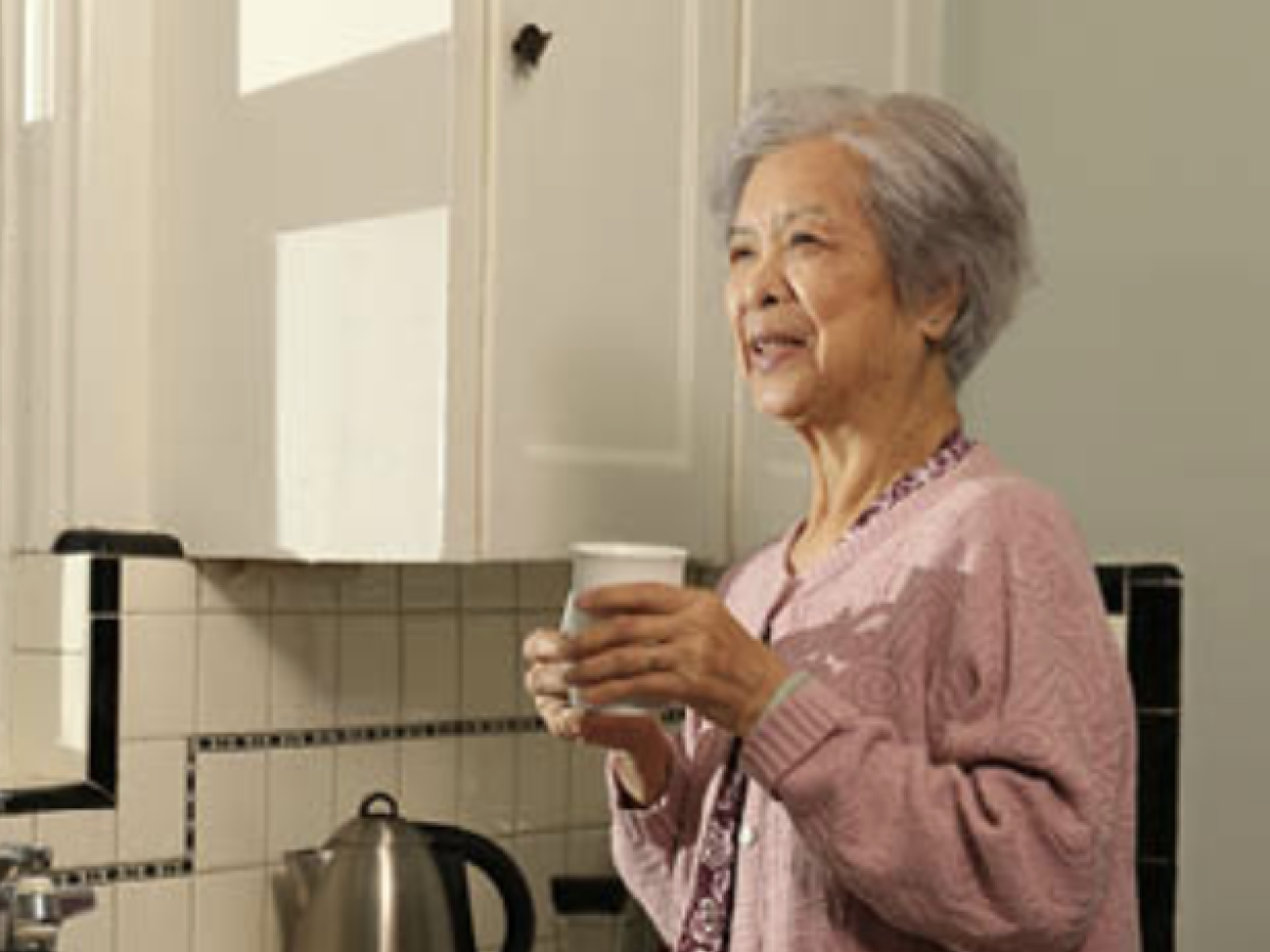 OESP Elderly woman drinking a cup of tea