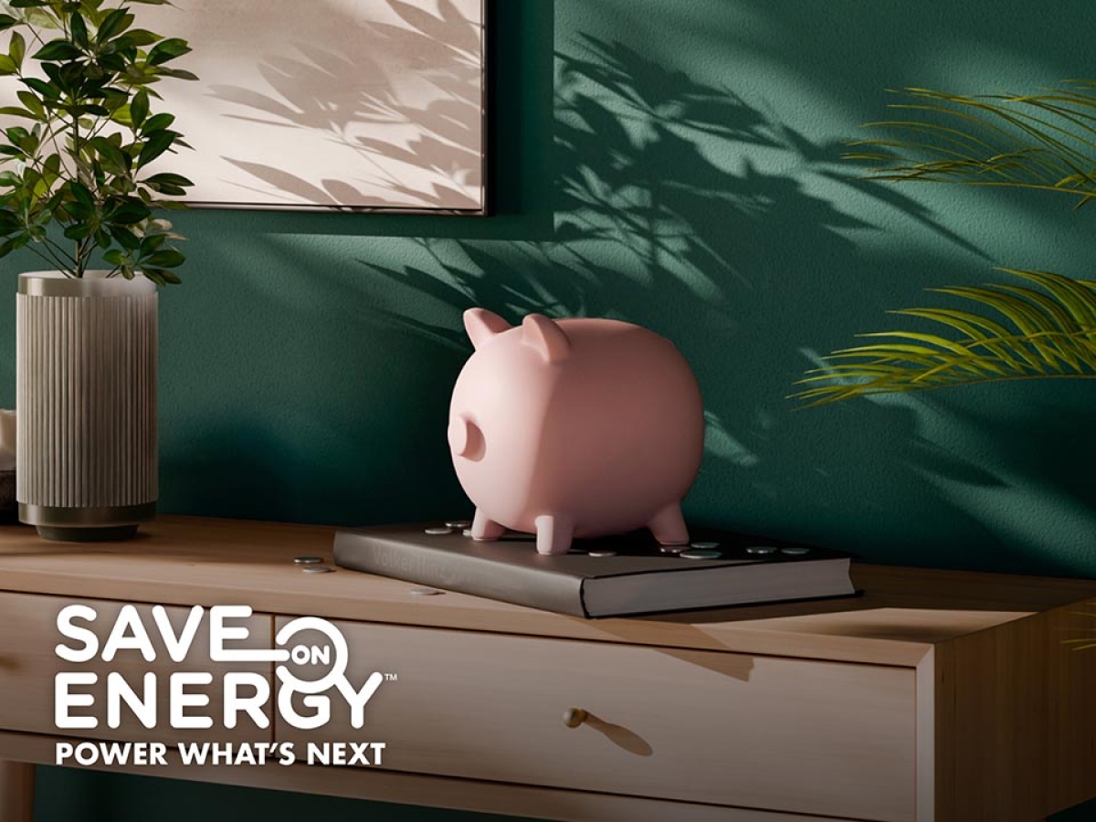 Piggy bank sitting on a shelf with a thermostat on the wall behind it